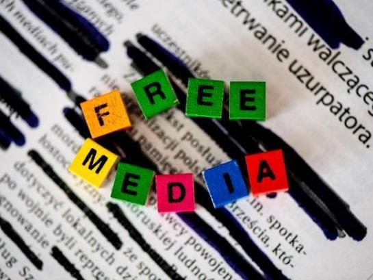News paper with coloured cubes saying ''free media'' 