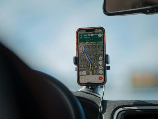  A GPS is positioned for the driver to view as he drives on the highway